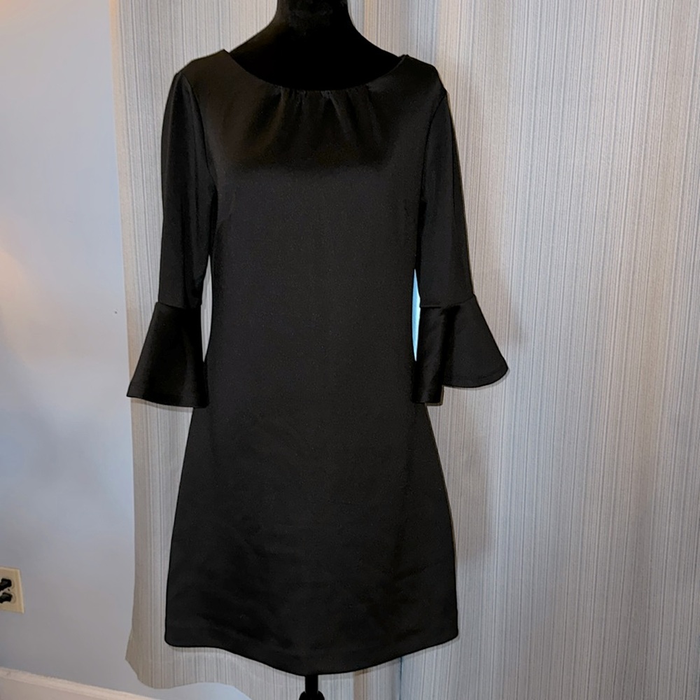 New York & Co. solid black long bell sleeves dress. Knee length size medium.